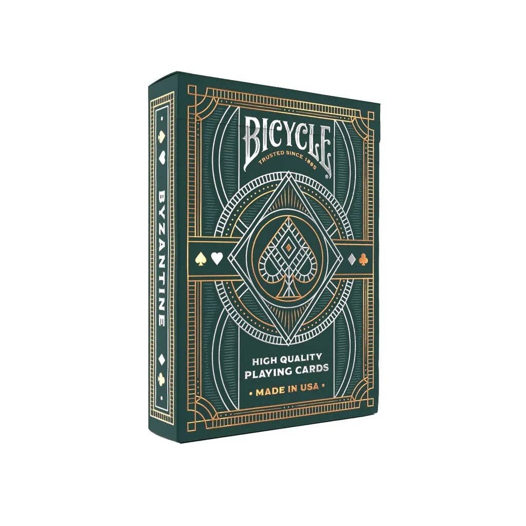 Bicycle playing card box with green and gold design on a white background