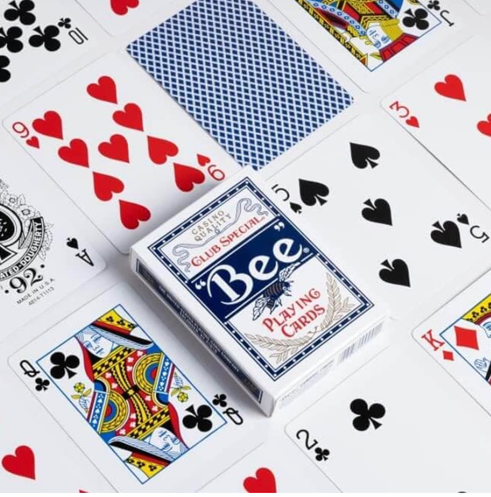 Bee Club Special Standard Index Blue Playing Cards displayed with the King of Spades, classic blue diamond-back playing card and Bee deck box.