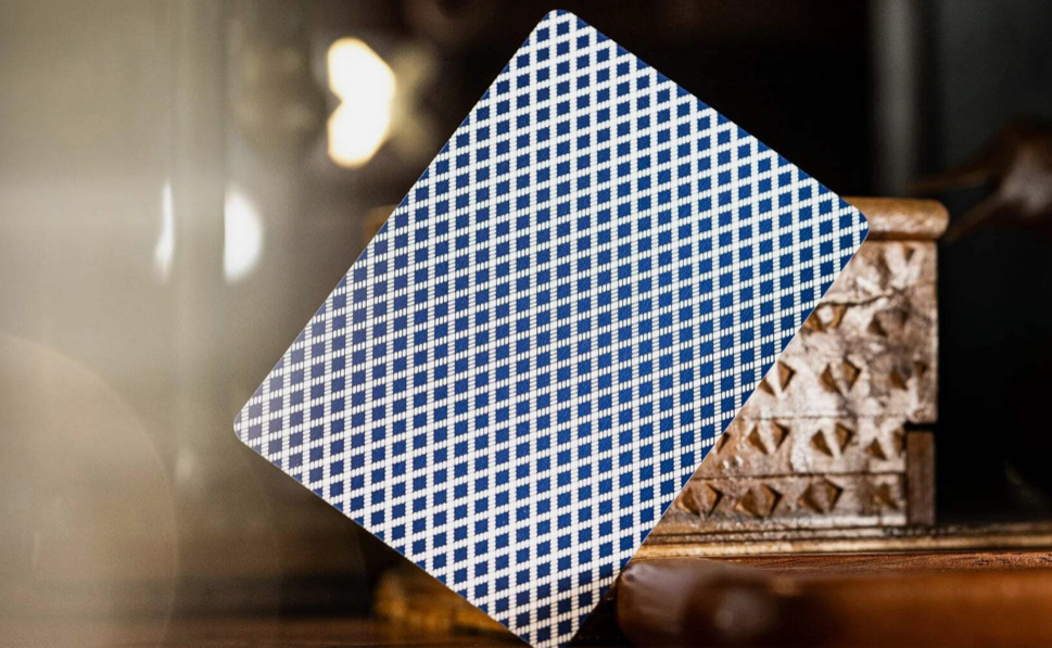 Close-up of a Bee Club Special Standard Index Blue playing card showing the classic blue and white diamond-back pattern and traditional casino-style design.
