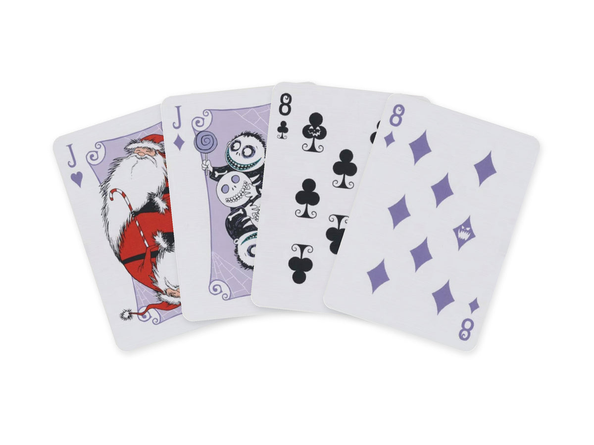 Four Bicycle Disney The Nightmare Before Christmas playing cards arranged in a fan, featuring Santa Claus, a Halloween Town character, the Eight of Clubs and purple Eight of Diamonds.
