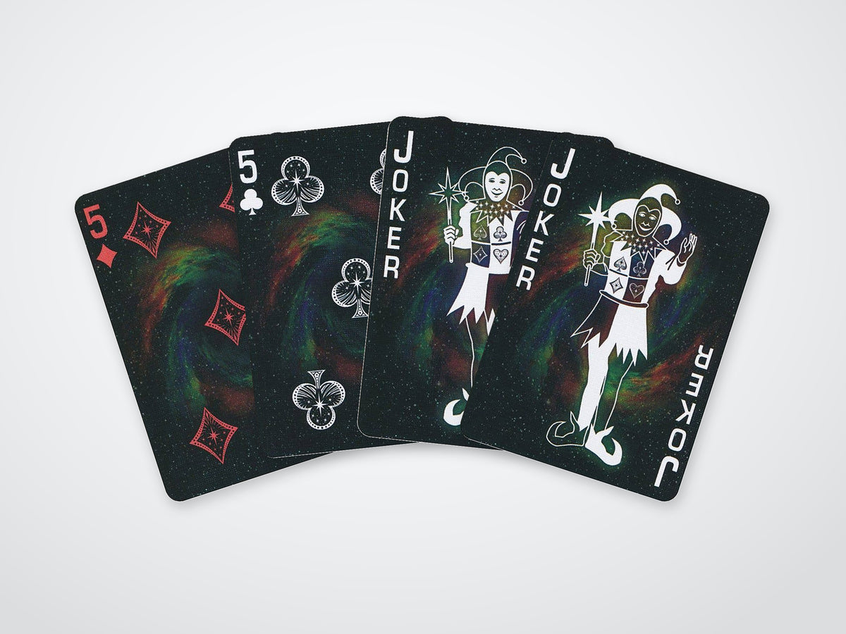 Four-card fan showcasing the Stargazer Nebula deck’s galaxy artwork, custom suits and two Jokers.