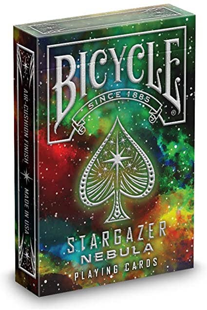 Bicycle Stargazer Nebula playing cards in a colourful, space-themed tuck box.
