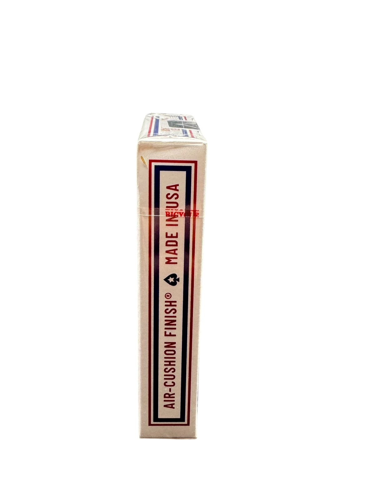 Side view of sealed Bicycle Stars and Stripes Playing Cards tuck box showing Air-Cushion Finish and Made in USA lettering with red and blue decorative borders.