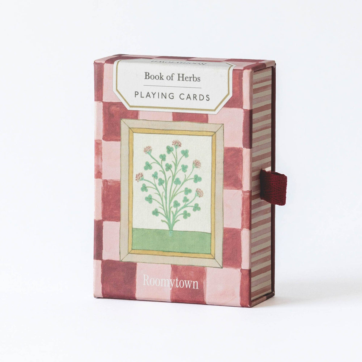 Front view of Roomytown Book of Herbs Playing Cards showing vintage floral illustration and pink striped box