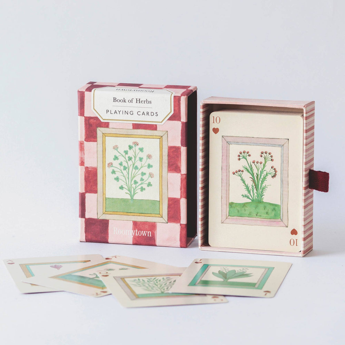 Book of Herbs Playing Cards by Roomytown showing botanical card faces and pink pull drawer presentation box