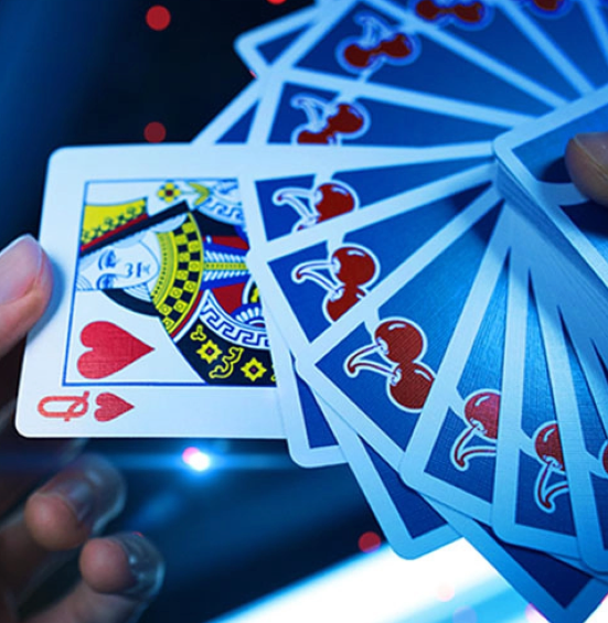 Cherry Casino Tahoe Blue Playing Cards displayed in a fan, showing the Queen of Hearts alongside vibrant blue card backs featuring red cherry artwork and white borders.