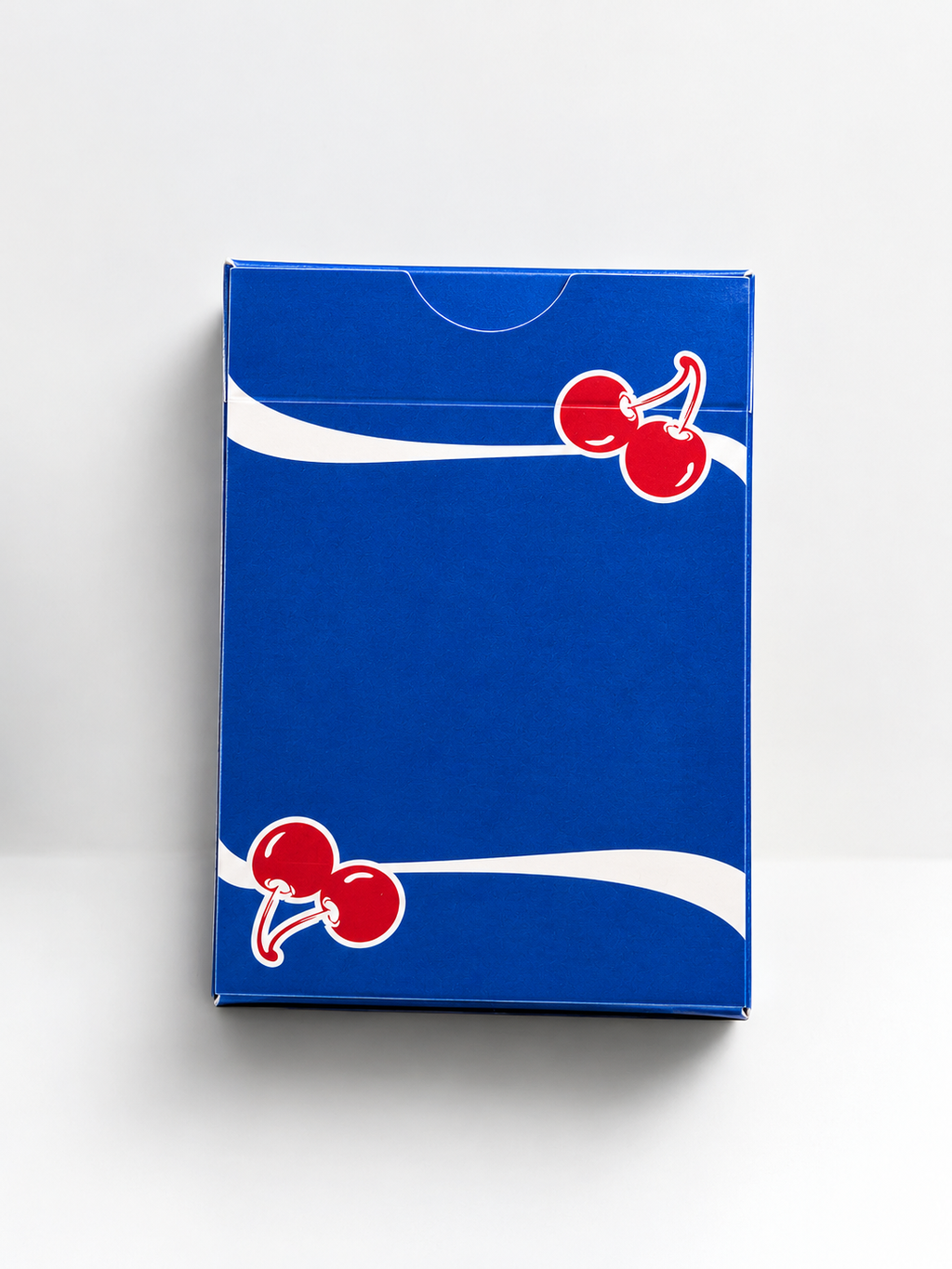 Rear view of Cherry Casino Tahoe Blue Playing Cards tuck box featuring vibrant blue artwork, red cherries, flowing white stripes and a thumb opening at the top.