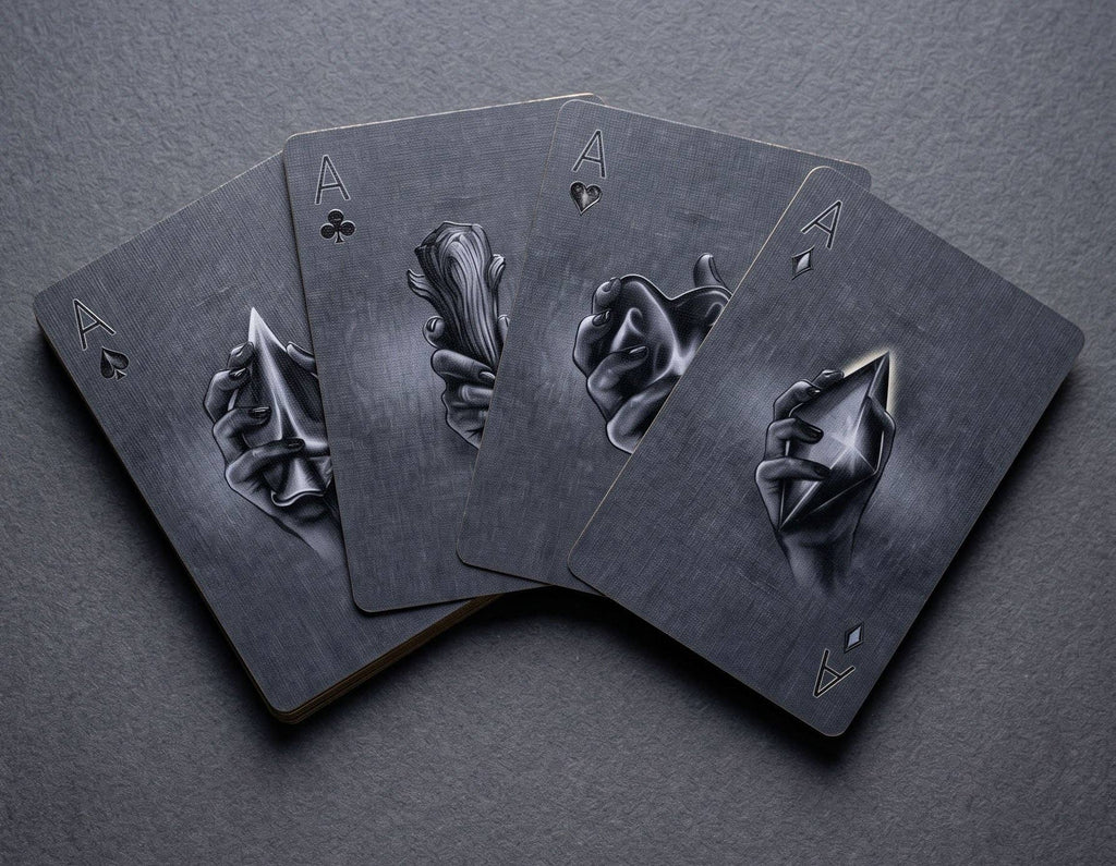 Classic Monsters Playing Cards by Collectible Playing Cards showing all four Aces with gothic illustrations of hands holding gemstones and other objects.