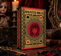 Haunted Dolls Playing Cards by CPC featuring an ornate black, red and gold tuck box displayed in a gothic Victorian setting with a porcelain doll, candlelight, antique books and vintage keys.