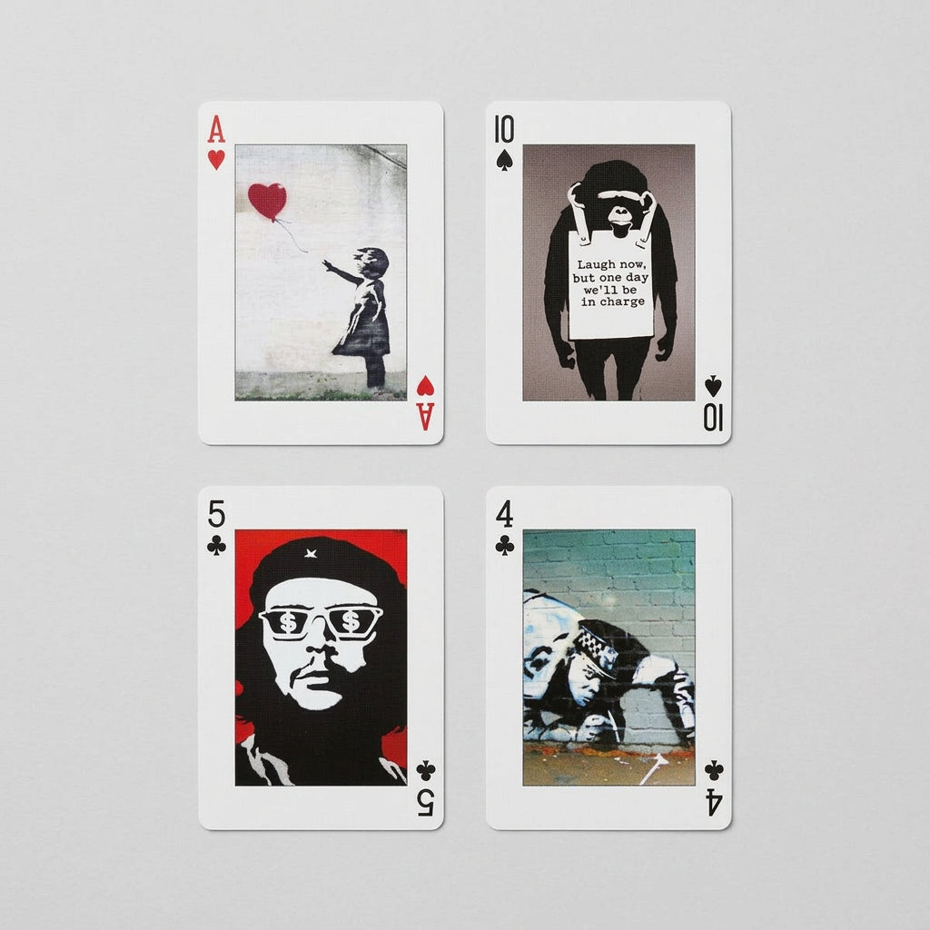 Piatnik Banksy First Collection playing cards featuring Girl with Balloon, a monkey wearing a sign, a portrait with dollar-sign glasses and a crouching police officer