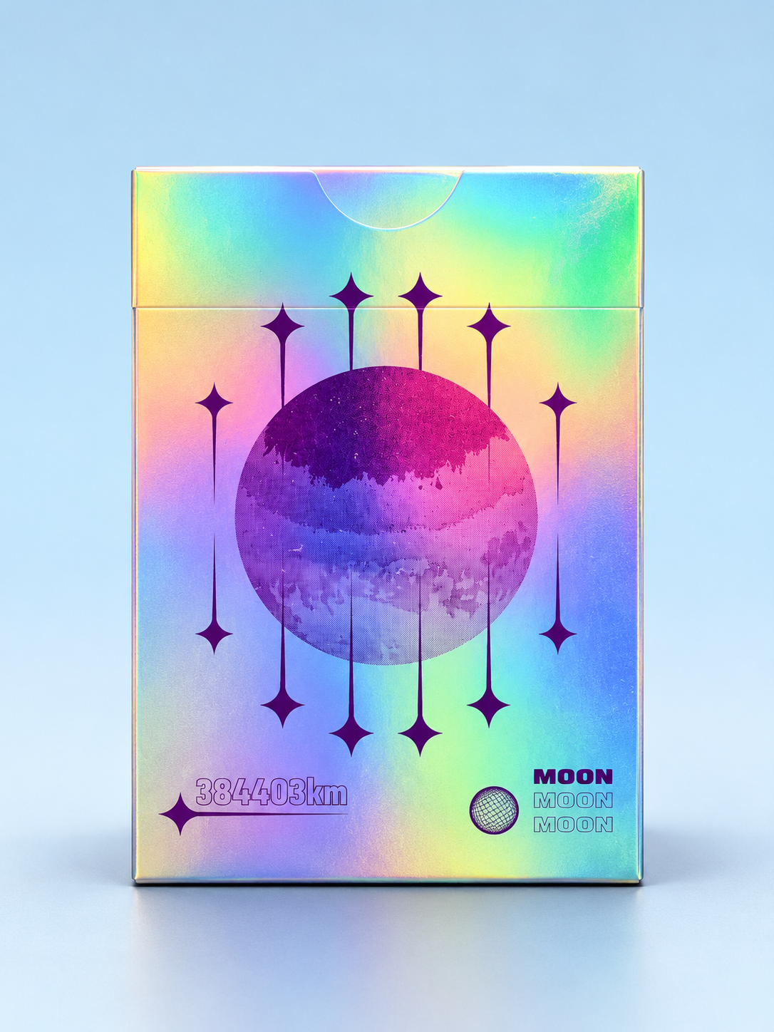 Back of Moon White Holo Playing Cards by Hiddenlight featuring an iridescent rainbow holographic tuck box, purple lunar artwork, decorative starbursts and a colourful moon design.