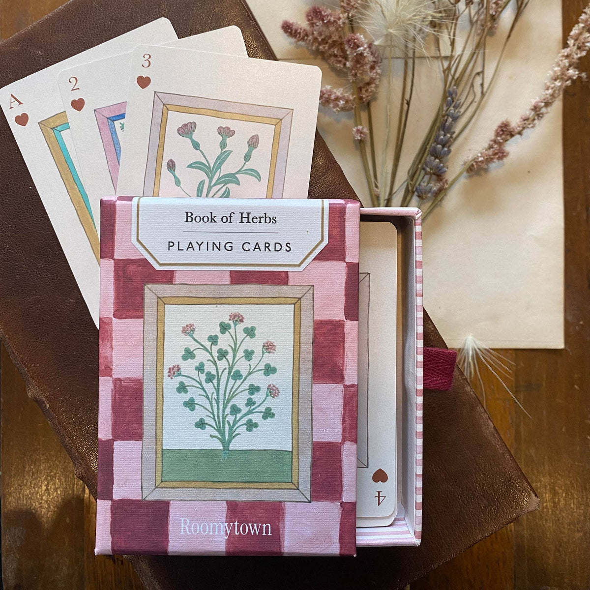 Roomytown Book of Herbs Playing Cards displayed with botanical artwork and decorative presentation packaging