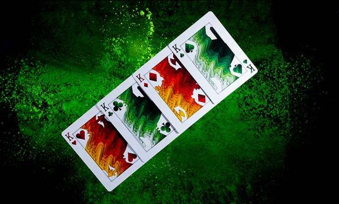 Four custom Kings from the SIRIUS-B V4 Spring Edition Playing Cards by Riffle Shuffle, showing the green, red and orange court card artwork