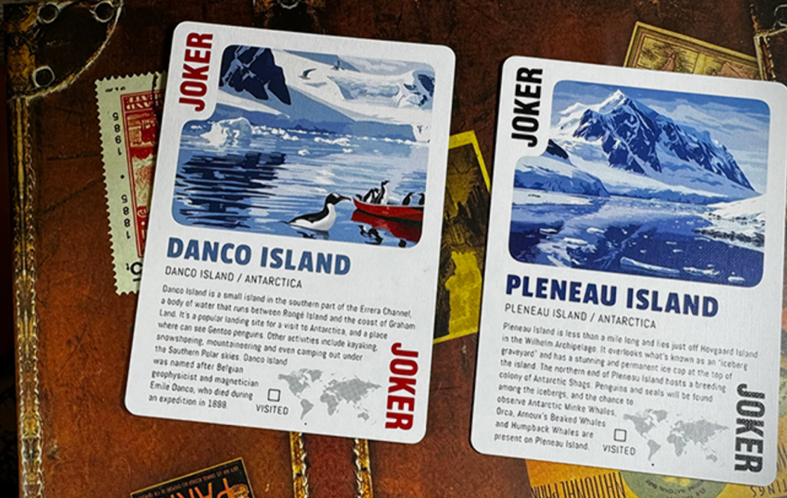 Travel the World Volume 1 playing cards by Midnight Cards featuring two illustrated Joker cards depicting Danco Island with penguins and Pleneau Island with icy Antarctic mountains.